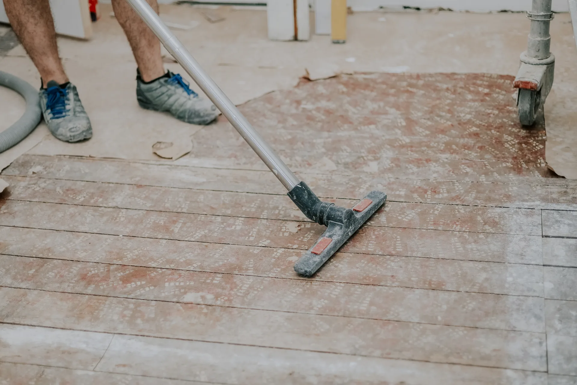Commercial vacuum cleaning a hard floor in a corporate kitchen